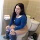 A pudgy brunette wearing glasses pisses and takes a wet, gassy-sounding shit while sitting on a toilet in her bathroom. Over 6.5 minutes.
